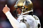 LANDOVER, MD - DECEMBER 06:  Quarterback Drew Brees #9 of the New Orleans Saints gives instructions against the Washington Redskins on December 6, 2009 at FedExField in Landover, Maryland.  (Photo by Chris McGrath/Getty Images)