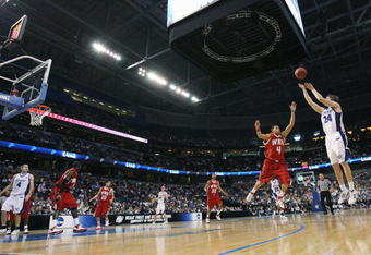 TAMPA, FL - MARCH 21:  Klayton Korver #24 of the Drake Bulldogs attempts a basket as he is guarded by A.J. Slaughter #4 of the Western Kentucky Hilltoppers during their game in the first round of the 2008 NCAA Tournament West Regional at the St. Pete Times Forum on March 21, 2008 in Tampa, Florida.  (Photo by Doug Benc/Getty Images)
