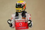 ABU DHABI, UNITED ARAB EMIRATES - OCTOBER 31:  Lewis Hamilton of Great Britain and McLaren Mercedes celebrates in parc ferme after taking pole position during qualifying for the Abu Dhabi Formula One Grand Prix at the Yas Marina Circuit on October 31, 2009 in Abu Dhabi, United Arab Emirates.  (Photo by Ker Robertson/Getty Images)