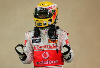ABU DHABI, UNITED ARAB EMIRATES - OCTOBER 31:  Lewis Hamilton of Great Britain and McLaren Mercedes celebrates in parc ferme after taking pole position during qualifying for the Abu Dhabi Formula One Grand Prix at the Yas Marina Circuit on October 31, 2009 in Abu Dhabi, United Arab Emirates.  (Photo by Ker Robertson/Getty Images)