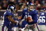 EAST RUTHERFORD, NJ - DECEMBER 06:  Eli Manning #10 of the New York Giants looks to throw a pass against the Dallas Cowboys on December 6, 2009 at Giants Stadium in East Rutherford, New Jersey. The Giants defeated the Cowboys 31-24.  (Photo by Jim McIsaac/Getty Images)