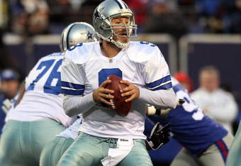 EAST RUTHERFORD, NJ - DECEMBER 06:  Tony Romo #9 of the Dallas Cowboys looks to throw a pass against the New York Giants on December 6, 2009 at Giants Stadium in East Rutherford, New Jersey. The Giants defeated the Cowboys 31-24.  (Photo by Jim McIsaac/Getty Images)