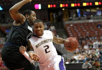 ANAHEIM, CA - DECEMBER 12:   Isaiah Thomas #2 of the Washington Huskies drives around Austin Freeman #15 of the Georgetown Hoyas in the John Wooden Classic on December 12, 2009 at the Honda Center in Anaheim, California. (Photo by Stephen Dunn/ Getty Images)