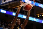 PHILADELPHIA - MARCH 19:  Larry Sanders #1 of the VCU Rams slam dunks against Alfred Aboya #12 of the UCLA Bruins during the first round of the NCAA Division I Men's Basketball Tournament at the Wachovia Center on March 19, 2009 in Philadelphia, Pennsylvania.  (Photo by Jim McIsaac/Getty Images)