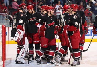 GLENDALE, AZ - DECEMBER 05:  The Phoenix Coyotes congratulate goaltender Ilya Bryzgalov #30 after defeating the Ottawa Senators in the NHL game at Jobing.com Arena on December 5, 2009 in Glendale, Arizona.  The Coyotes defeated the Senators 3-2.  (Photo by Christian Petersen/Getty Images)