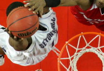 LOUISVILLE, KY - MARCH 04:  Earl Clark #5 of the Louisville Cardinals blocks the shot of Larry Davis #35 of the Seton Hall Pirates in a Big East Conference game on March 4, 2007 at Freedom Hall in Louisville, Kentucky.  Louisville won  86-71. (Photo by Andy Lyons/Getty Images)