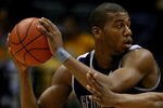 MILWAUKEE - JANUARY 31: Greg Monroe #10 of the Georgetown Hoyas looks to pass as Dwight Burke #12 of the Marquette Golden Eagles defends on January 31, 2009 at the Bradley Center in Milwaukee, Wisconsin. Marquette defeated Georgetown 94-82.  (Photo by Jonathan Daniel/Getty Images)