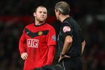 MANCHESTER, ENGLAND - DECEMBER 12:  Wayne Rooney of Manchester United is spoken to by Referee Martin Atkinson during the Barclays Premier League match between Manchester United and Aston Villa at Old Trafford on December 12, 2009 in Manchester, England.  (Photo by Clive Brunskill/Getty Images)