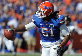 GAINESVILLE, FL - NOVEMBER 21: Linebacker Brandon Spikes #51 of the Florida Gators returns an interception 40 yards for a first-quarter touchdown against the Florida International University Golden Panthers, November 21, 2009 at Ben Hill Griffin Stadium in Gainesville, Florida.  (Photo by Al Messerschmidt/Getty Images)