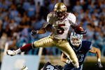 CHAPEL HILL, NC - OCTOBER 22:  Greg Reid #5 of the Florida State Seminoles leaps over North Carolina Tar Heels defenders Kennedy Tinsley #36 and Hunter Furr, #40 at Kenan Stadium on October 22, 2009 in Chapel Hill, North Carolina.  (Photo by Scott Halleran/Getty Images)