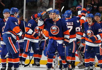 UNIONDALE, NY - DECEMBER 12:  The New York Islanders celebrate the game winning overtime goal by Frans Nielsen #51 against the Boston Bruins during their game at the Nassau Coliseum on December 12, 2009 at the Nassau Coliseum in Uniondale, New York.  (Photo by Al Bello/Getty Images)