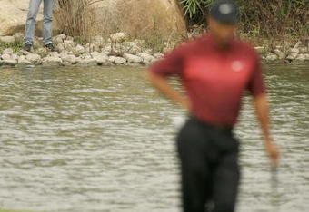 SHANGHAI, CHINA - NOVEMBER 13:  Tiger Woods of the USA has his picture taken on 2nd hole during the final round the HSBC Champions Tournament at the Sheshan International Golf Club on November 13, 2005 in Shanghai, China.  (Photo by Ross Kinnaird/Getty Images)