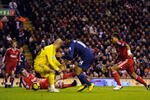 LIVERPOOL, ENGLAND - DECEMBER 13:  Glen Johnson of Liverpool scores an own goal during the Barclays Premier League match between Liverpool and Arsenal at Anfield on December 13, 2009 in Liverpool, England. (Photo by Michael Regan/Getty Images)
