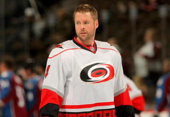 DENVER - OCTOBER 23:  Aaron Ward #4 of the Carolina Hurricanes warms up prior to facing the Colorado Avalanche during NHL action at the Pepsi Center on October 23, 2009 in Denver, Colorado. The Avlanche defeated the Hurricanes 5-4.  (Photo by Doug Pensinger/Getty Images)