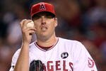 ANAHEIM, CA - OCTOBER 22:  John Lackey #41 of the Los Angeles Angels of Anaheim reacts in Game Five of the ALCS against the New York Yankees during the 2009 MLB Playoffs at Angel Stadium on October 22, 2009 in Anaheim, California.  (Photo by Stephen Dunn/Getty Images)
