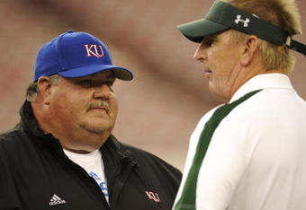 TAMPA, FL - SEPTEMBER 12: Coach Mark Mangino of the Kansas Jayhawks and coach Jim Leavitt of the South Florida Bulls talk before play at Raymond James Stadium on September 12, 2008 in Tampa, Florida.  (Photo by Al Messerschmidt/Getty Images)