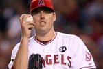 ANAHEIM, CA - OCTOBER 22:  John Lackey #41 of the Los Angeles Angels of Anaheim reacts in Game Five of the ALCS against the New York Yankees during the 2009 MLB Playoffs at Angel Stadium on October 22, 2009 in Anaheim, California.  (Photo by Stephen Dunn/Getty Images)