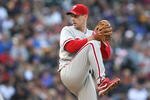 DENVER - OCTOBER 11:  Cliff Lee #34 of the Philadelphia Phillies pitches against the Colorado Rockies in Game Four of the NLDS during the 2009 MLB Playoffs at Coors Field on October 12, 2009 in Denver, Colorado. (Photo by Jed Jacobsohn/Getty Images)