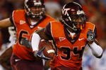 BLACKSBURG, VA - OCTOBER 29:  Running back Ryan Williams #34 of the Virginia Tech University Hokies carries the ball in the first quarter of the game against the North Carolina Tar Heels at Lane Stadium on October 29, 2009 in Blacksburg, Virginia.  (Photo by Scott Halleran/Getty Images)