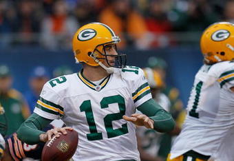 CHICAGO - DECEMBER 13: Aaron Rodgers #12 of the Green Bay Packers looks for a receiver against the Chicago Bears at Soldier Field on December 13, 2009 in Chicago, Illinois. The Packers defeated the Bears 21-14. (Photo by Jonathan Daniel/Getty Images)