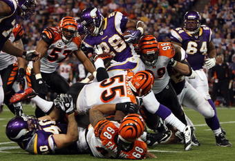 MINNEAPOLIS, MN - DECEMBER 13:  Adrian Peterson #28 of the Minnesota Vikings runs the ball against the Cincinnati Bengals on December 13, 2009 at Hubert H. Humphrey Metrodome in Minneapolis, Minnesota. The Vikings defeated the Bengals 30-10.  (Photo by Jim McIsaac/Getty Images)