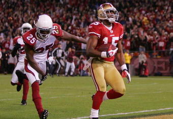 SAN FRANCISCO - DECEMBER 14: Wide receiver Michael Crabtree #15 of the San Francisco 49ers scores a touchdown in the first half against the Arizona Cardinals at Candlestick Park on December 14, 2009 in San Francisco, California. (Photo by Ezra Shaw/Getty Images)