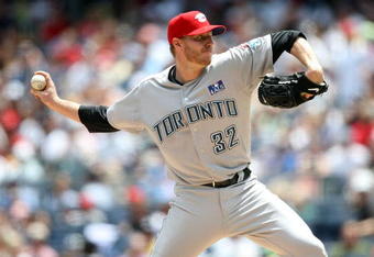 NEW YORK - JULY 04:  Roy Halladay #32 of the Toronto Blue Jays pitches against the New York Yankees on July 4, 2009 at Yankee Stadium in the Bronx borough of New York City.  (Photo by Nick Laham/Getty Images)