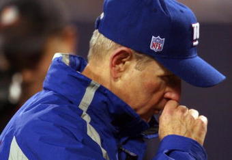 EAST RUTHERFORD, NJ - NOVEMBER 12:  Head coach Tom Coughlin of the New York Giants walks off of the field after losing to the Chicago Bears at Giants Stadium on November 12, 2006 in East Rutherford, New Jersey. The Giants lost the game 38-20.  (Photo by Nick Laham/Getty Images)