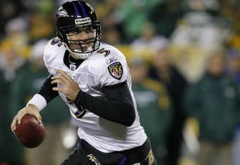GREEN BAY, WI - DECEMBER 7:  Joe Flacco #5 of the Baltimore Ravensrolls out to pass against the Green Bay Packers at Lambeau Field on December 7, 2009 in Green Bay, Wisconsin.  (Photo by Jonathan Daniel/Getty Images)