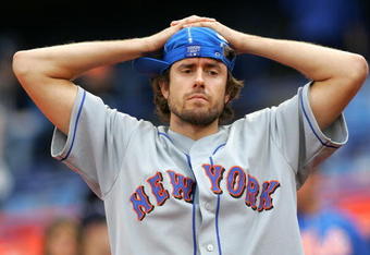 NEW YORK - SEPTEMBER 30:  A disconcerted New York Mets fan reacts following the Mets' loss to the Florida Marlins during the MLB game at Shea Stadium September 30, 2007 in the Flushing neighborhood of the Queens borough of New York City. The Marlins defeated the Mets 8-1. (Photo by Chris Trotman/Getty Images)