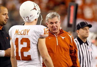 ARLINGTON, TX - DECEMBER 05:  Head coach Mack Brown of the Texas Longhorns talks with Colt McCoy #12 at Cowboys Stadium on December 5, 2009 in Arlington, Texas.  (Photo by Ronald Martinez/Getty Images)