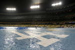 LOS ANGELES, CA - APRIL 02:  The Los Angeles Dodgers logo is seen soaked with rain during a rain delay of the game against the San Francisco Giants on April 2,2008 at Dodger Stadium in Los Angeles,California.  (Photo by Harry How/Getty Images)