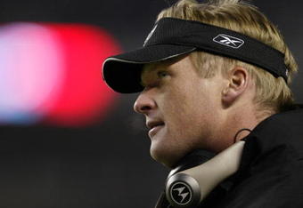 30 Dec 2001:  Head coach Jon Gruden of the Oakland Raiders looks less than thrilled after the offense turned the ball over on downs to the Denver Broncos late in the fourth quarter at Mile High Stadium in Denver, Colorado.  The Broncos won 23-17.  DIGITAL IMAGE Mandatory Credit: Brian Bahr/Getty Images