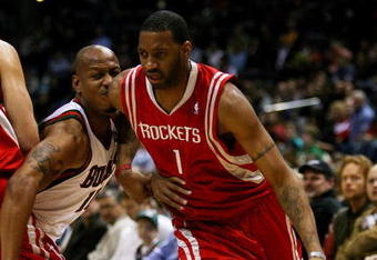 MILWAUKEE - FEBRUARY 09: Tracy McGrady #1 of the Houston Rockets collides with Keith Bogans #10 of the Milwaukee Bucks on a screen set by Yao Ming #11 on February 9, 2009 at the Bradley Center in Milwaukee, Wisconsin. The Bucks defeated the Rockets 124-112. NOTE TO USER: User expressly acknowledges and agreees that, by downloading and/or using this Photograph, User is consenting to the terms and conditions of the Getty Images License Agreement.  (Photo by Jonathan Daniel/Getty Images)