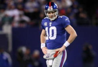 EAST RUTHERFORD, NJ - DECEMBER 13:  Eli Manning #10 of the New York Giants looks on from the field during the game against the Philadelphia Eagles at Giants Stadium on December 13, 2009 in East Rutherford, New Jersey.  (Photo by Nick Laham/Getty Images)