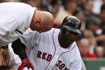 BOSTON - AUGUST 22:  David Ortiz #34 of the Boston Red Sox gets checked by the Red Soxs trainers after fouling a pitch off his ankle in the sixth inning against the New York Yankees at Fenway Park on August 22, 2009 in Boston, Massachusetts. (Photo by Jim Rogash/Getty Images)