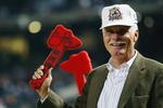 ATLANTA - SEPTEMBER 30:  Ted Turner does the tomahawk chop during Game 1 of the National League Division Series between the Chicago Cubs and the Atlanta Braves on September 30, 2003  at Turner Field in Atlanta, Georgia.  The Cubs defeated the Braves 4-2.  (Photo by Jamie Squire/Getty Images)