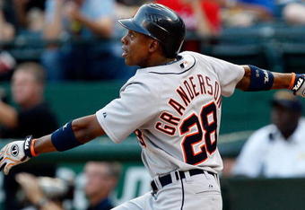 ARLINGTON, TX - JULY 29:  Center fielder Curtis Granderson #28 of the Detroit Tigers hits his second home run of the game in the second inning against the Texas Rangers on July 29, 2009 at Rangers Ballpark in Arlington, Texas.  (Photo by Ronald Martinez/Getty Images)