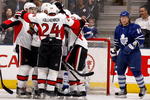 TORONTO - DECEMBER 14:  Mikhail Grabovski #84 of the Toronto Maple Leafs skates away as the Ottawa Senators celebrate goal during action December 14, 2009 at the Air Canada Centre in Toronto, Ontario, Canada. (Photo by Abelimages/Getty Images)