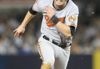 NEW YORK - MAY 21:  Nolan Reimold #14 of the Baltimore Orioles runs the bases against the New York Yankees on May 21, 2009 at Yankee Stadium in the Bronx borough of New York City.  (Photo by Nick Laham/Getty Images)