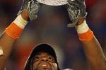 MIAMI - JANUARY 08:  Brandon Spikes #51 of the Florida Gators holds up the winning trophy after the FedEx BCS National Championship Game against the Oklahoma Sooners at Dolphin Stadium on January 8, 2009 in Miami, Florida.  (Photo by Eliot J. Schechter/Getty Images)