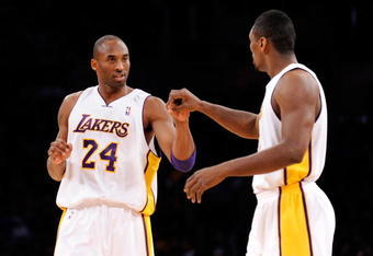 LOS ANGELES, CA - DECEMBER 06:  Kobe Bryant #24 of the Los Angeles Lakers is congratulated by teammate Ron Artest #37 after scoring a basket  against the Phoenix Suns during the first quarter at Staples Center on December 6, 2009 in Los Angeles, California. NOTE TO USER: User expressly acknowledges and agrees that, by downloading and/or using this Photograph, user is consenting to the terms and conditions of the Getty Images License Agreement.  (Photo by Kevork Djansezian/Getty Images)