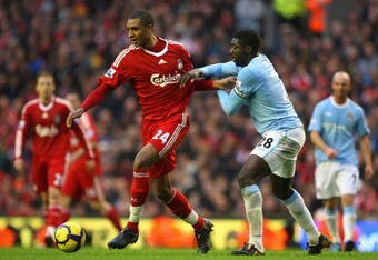 LIVERPOOL, ENGLAND - NOVEMBER 21:  David Ngog of Liverpool is challenged by Kolo Toure of Manchester City during the Barclays Premier League match between Liverpool and Manchester City at Anfield on November 21, 2009 in Liverpool, England.  (Photo by Mark Thompson/Getty Images)