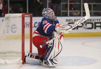 NEW YORK - DECEMBER 06:  Henrik Lundqvist #30 of the New York Rangers reacts to letting in the second goal against the Detroit Red Wings on December 6, 2009 at Madison Square Garden in New York City.  (Photo by Nick Laham/Getty Images)