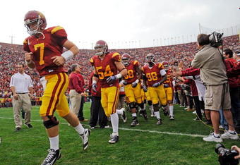 LOS ANGELES, CA - DECEMBER 05:  Matt Barkley #7 of the USC Trojans leads his team on to the field prior to the start of the NCAA college football game against the Arizona Wildcats at the Los Angeles Coliseum on December 5, 2009 in Los Angeles, California. (Photo by Kevork Djansezian/Getty Images)