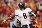 LOS ANGELES, CA - DECEMBER 05:  Quarterback Nick Foles #8 of the Arizona Wildcats throws a pass against the USC Trojans on December 5, 2009 at the Los Angeles Coliseum in Los Angeles, California. Arizona won 21-17.  (Photo by Stephen Dunn/Getty Images)
