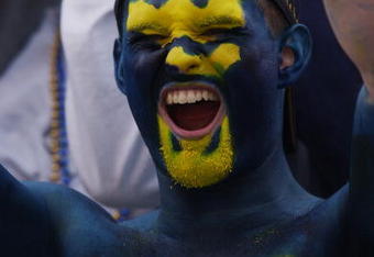 MORGANTOWN, WV - OCTOBER 26:  A fan of the West Virginia University Mountaineers cheers on his team during a Big East game against the University of Miami Hurricanes on October 26, 2002 at Mountaineer Field in Morgantown, West Virginia . Miami won 40-23.  (Photo By Doug Pensinger/Getty Images)