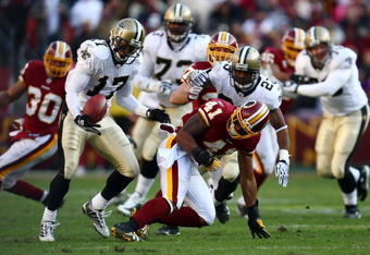 LANDOVER, MD - DECEMBER 06:  Robert Meachem #17 of the New Orleans Saints catches a fumble by Kareem Moore #41 of the Washington Redskins on December 6, 2009 at FedExField in Landover, Maryland.  (Photo by Chris McGrath/Getty Images)