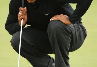 TURNBERRY, SCOTLAND - JULY 17:  Tiger Woods of USA lines up a putt on the 18th green during round two of the 138th Open Championship on the Ailsa Course, Turnberry Golf Club on July 17, 2009 in Turnberry, Scotland.  (Photo by Ross Kinnaird/Getty Images)