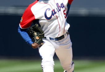 SAN DIEGO - MARCH 15: Aroldis Chapman #52 of team Cuba pitches against team Japan during the 2009 World Baseball Classic Round 2 Pool 1 match on March 15, 2009 at Petco Park in San Diego, California.  (Photo by Donald Miralle/Getty Images)